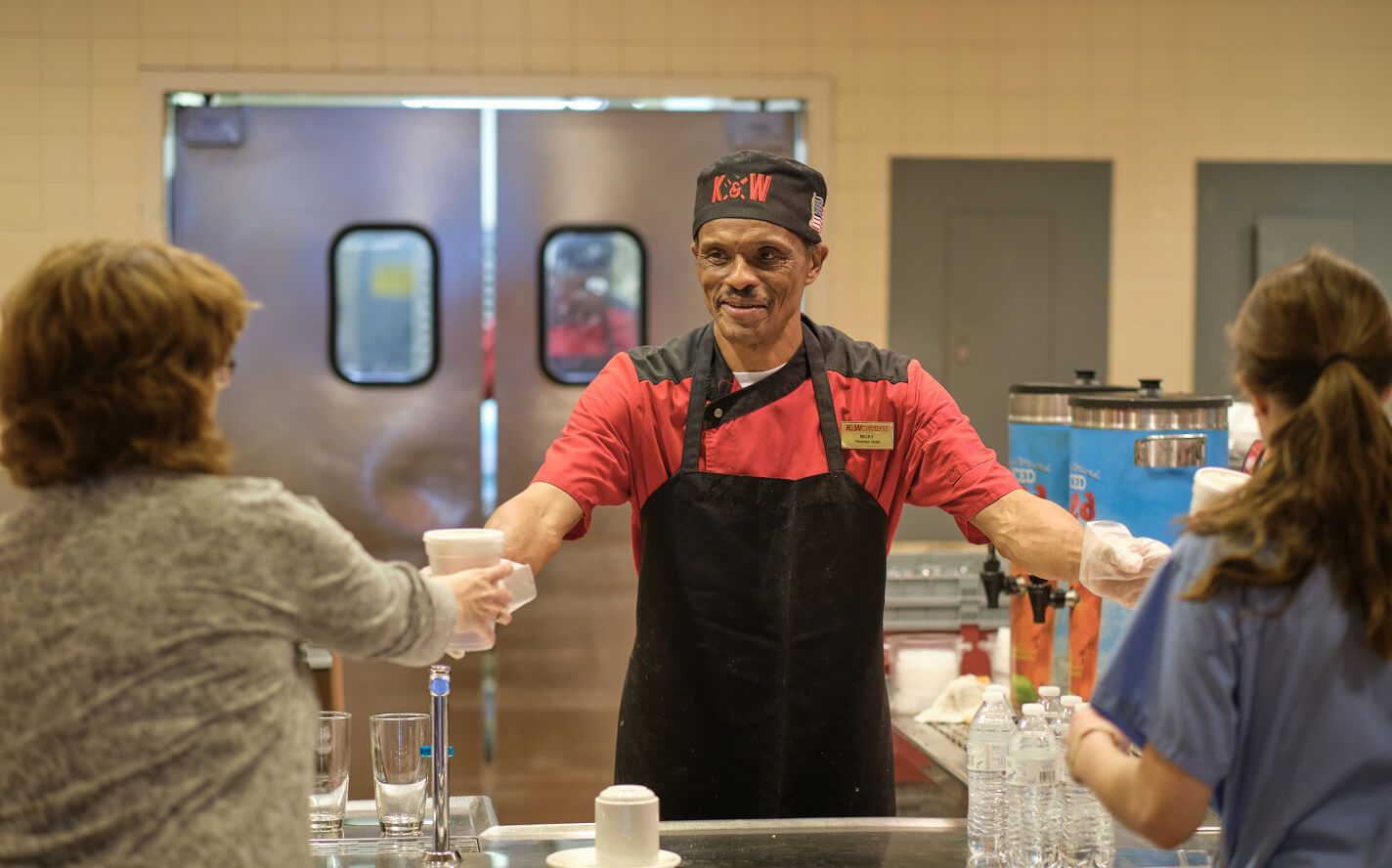 K&W chef serving guests on the cafeteria line