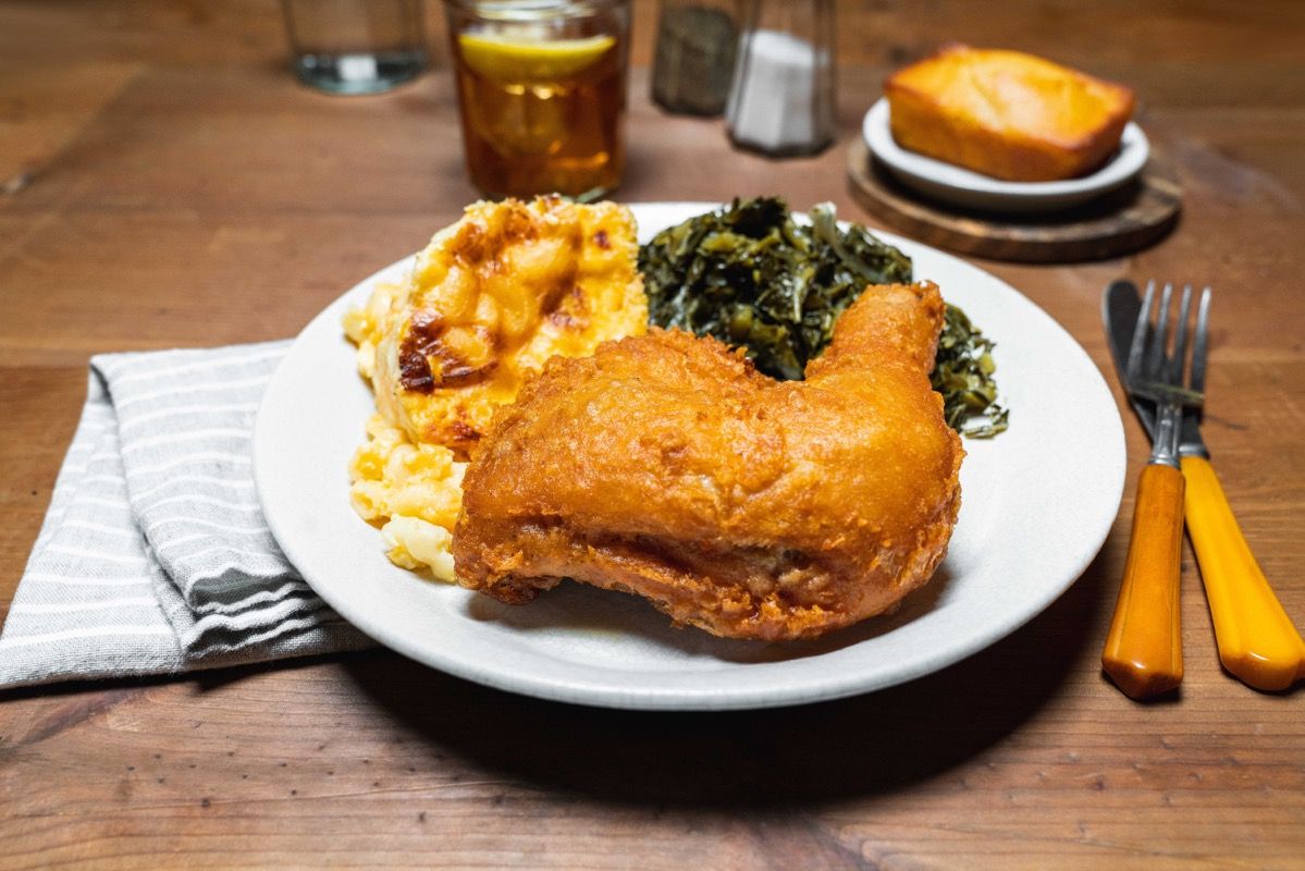 Fried chicken with cornbread, mac and cheese and collards