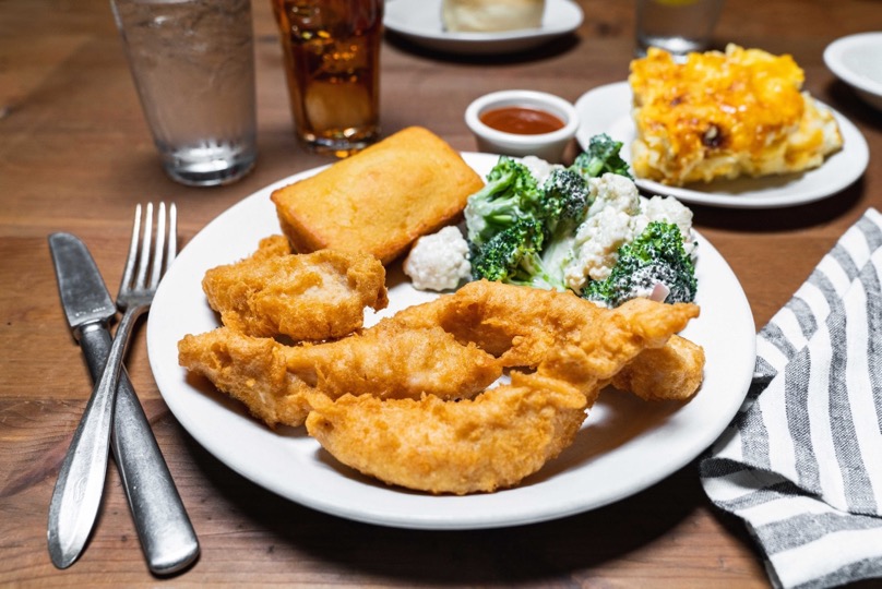 chicken tenders with broccoli salad and corn bread