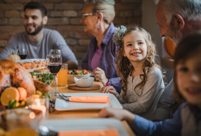Family at table smiling together