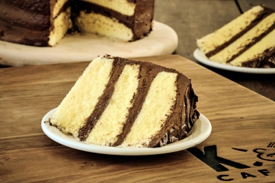 slice of yellow cake with chocolate frosting
