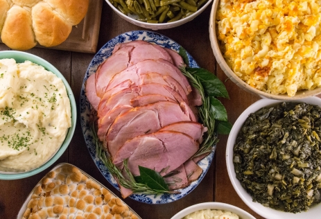 feat of ham, mashed potatoes, mac and cheese, turnips, green beans, sweet potato souffle and bread