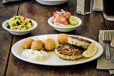 crab cakes with cucumber salad and hush puppies