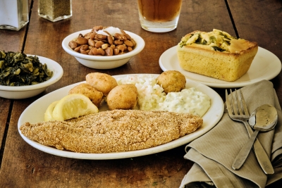 fried catfish with mashed potatoes, hush puppies, beans and turnips